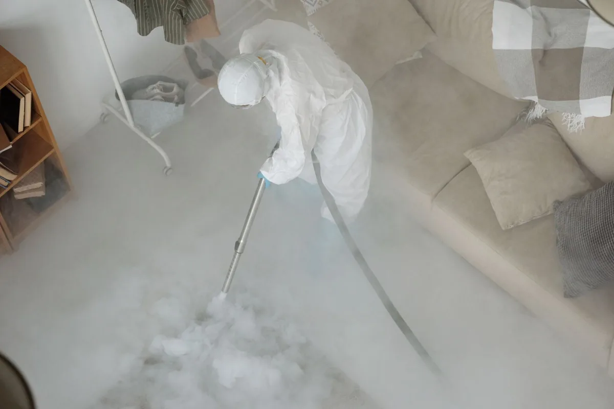 Biohazard cleanup technician in protective equipment, North Berwick, ME